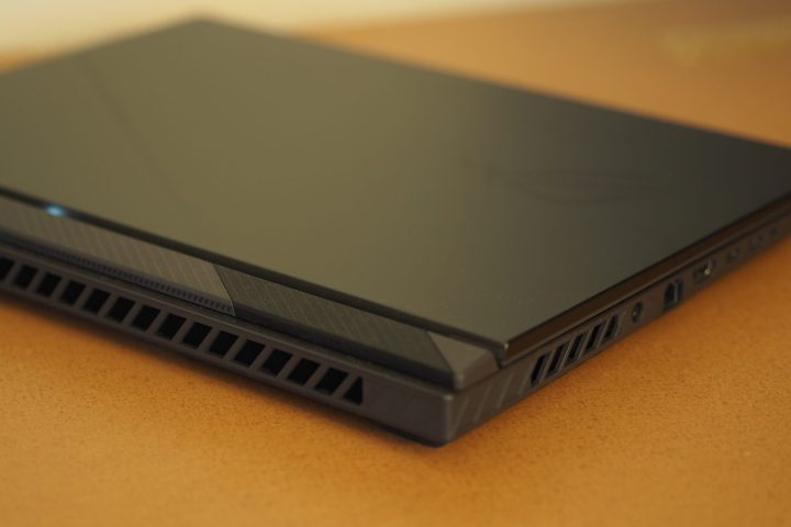 Asus ROG Strix G16 Review: Fast, Affordable Gaming Laptop Explored 12 Asus ROG Strix G16 rear edge showing vents and thickness.
