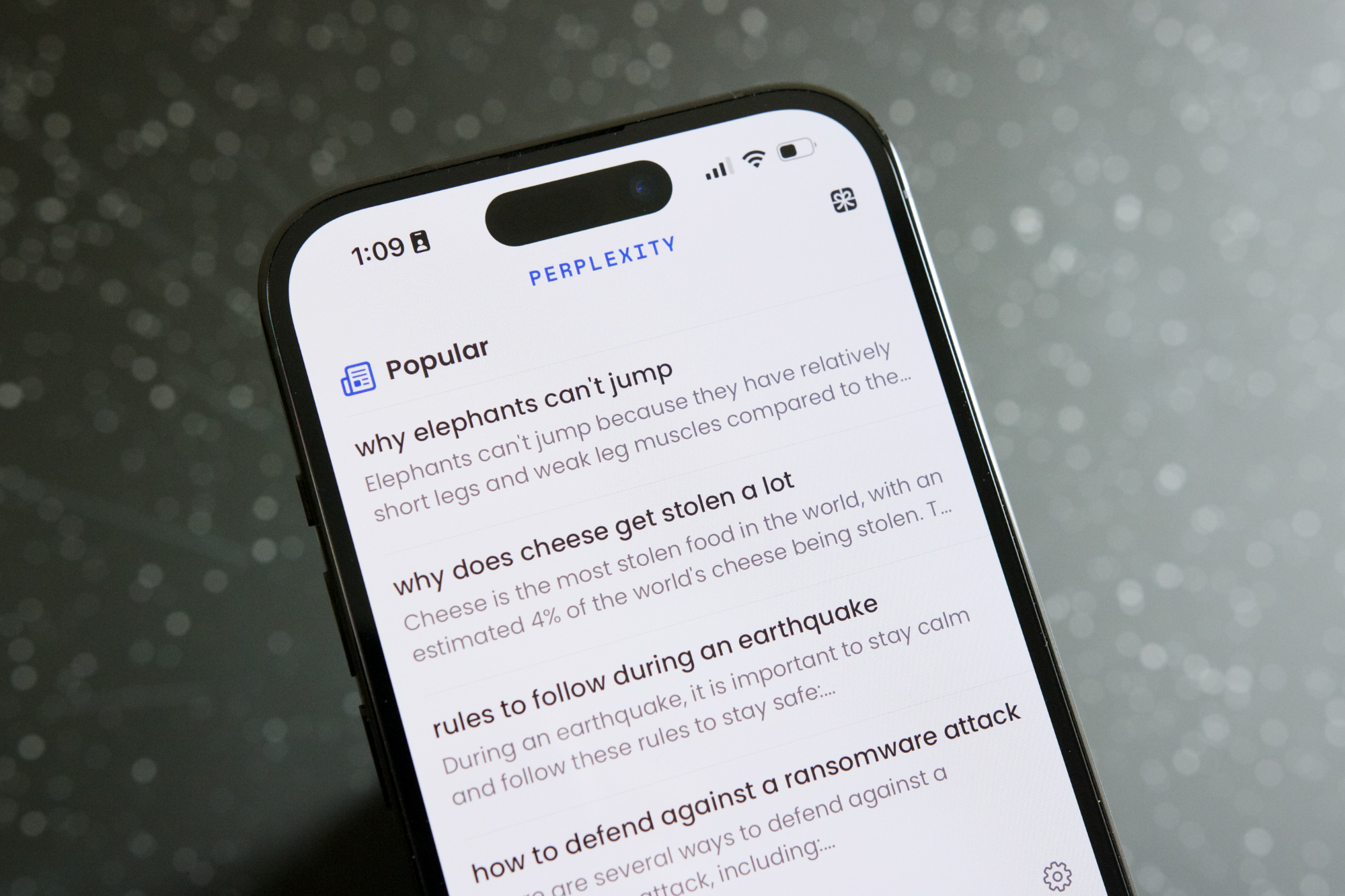 Top 5 AI Apps with Deep Research Features to Compete with ChatGPT 7 Perplexity AI app running on an iPhone 14 Pro.