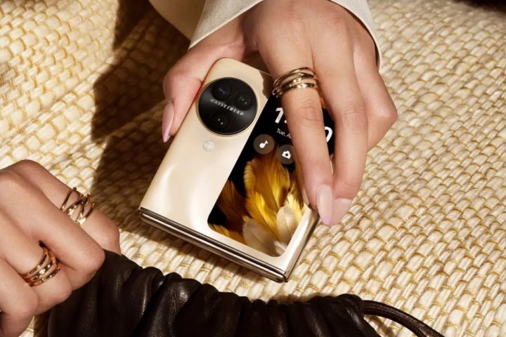 Top Flip Phone Designs Tested: Which One Reigns Supreme? 9 Person keeping Oppo Find N3 Flip gold in purse.