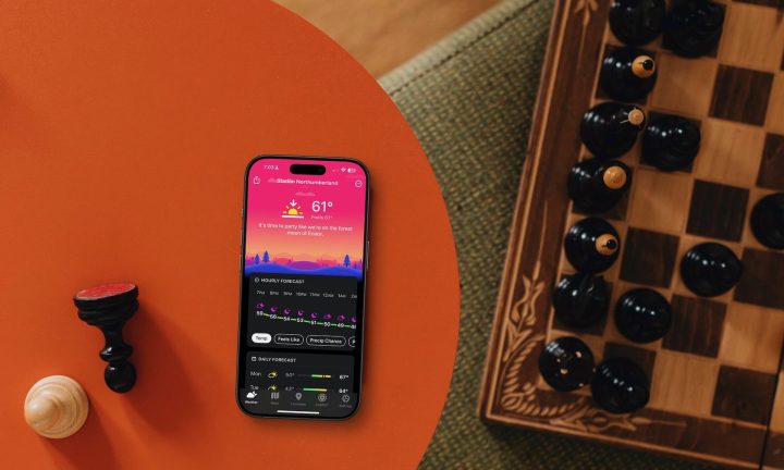 Outsmart Brutal AI Chess Bots with This Human-Thinking Strategy 7 Carrot Weather app on iPhone on table next to chess board.