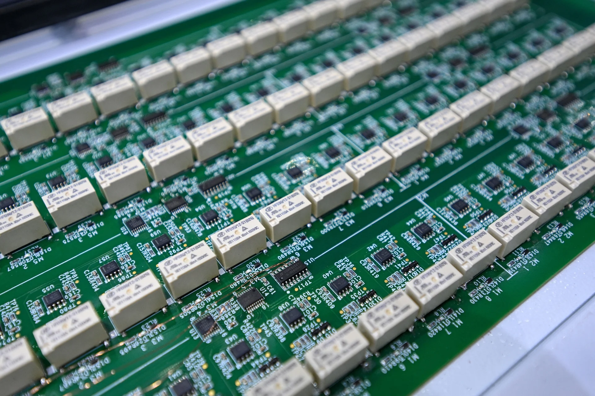 China’s AI Firewall: Building a Great Wall Around AI 7 A motherboard is displayed at the 2025 World Semiconductor Conference & Expo in Nanjing, in China's eastern Jiangsu province on June 20, 2025.
